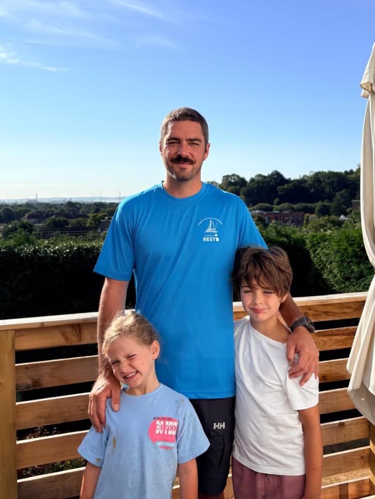 Luke with George and Olive, wearing a REST fundraising shirt